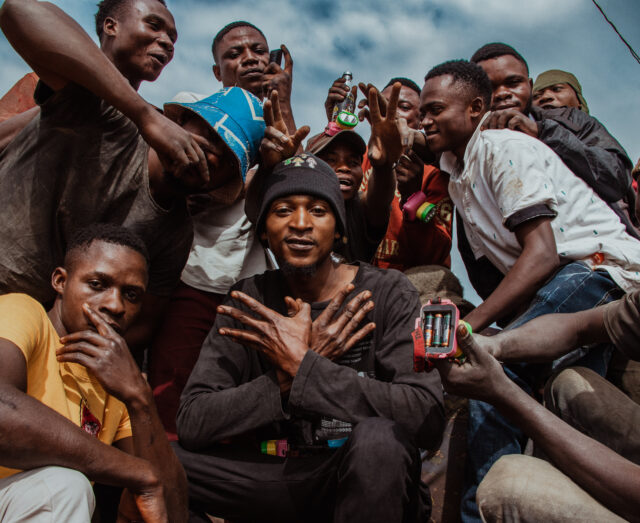 group of miners posing and looking into the camera